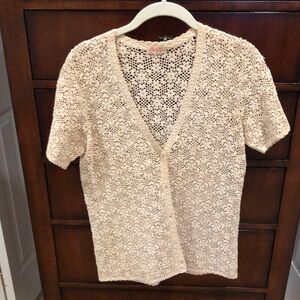 Beige crocheted short sleeve jacket sweater. Size Large with extra button inside